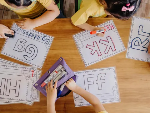 Kids tracing letter sounds at PLA